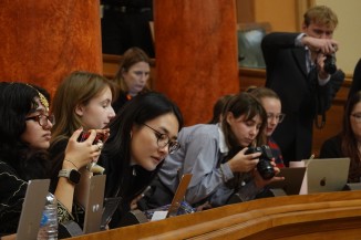 Youth Press Gallery members taking photos. 