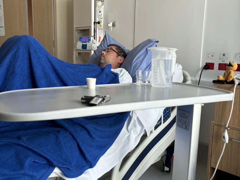 mike in hospital bed